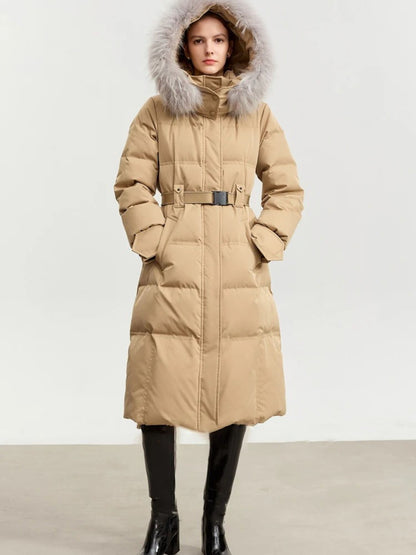 Camel puffer coat with silver fur hood, hands in pockets