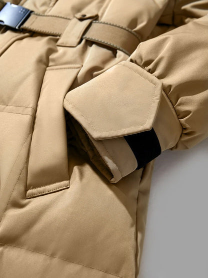 Close-up of camel coat showing front pocket and sleeve detail