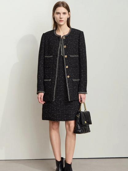 Full outfit view of black tweed set with long-sleeve jacket and mini skirt