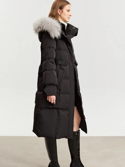 Side view of black puffer coat with silver fur hood, showing belt and length