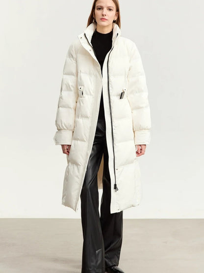 White longline puffer coat with fur-trimmed hood, open over black pants
