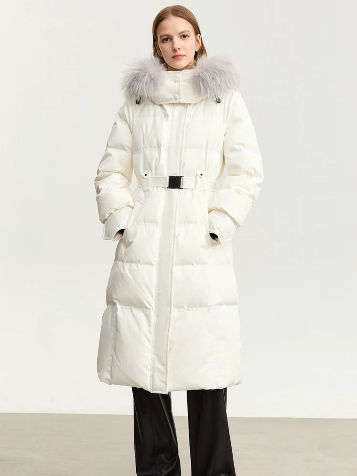 White puffer coat with fur hood and belt, shown from the front