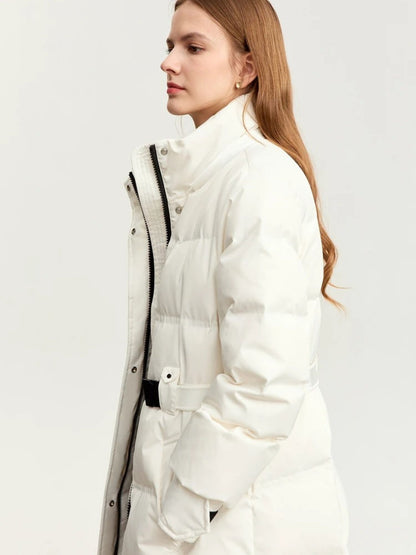 Side profile of model wearing belted white puffer coat with fur-lined hood
